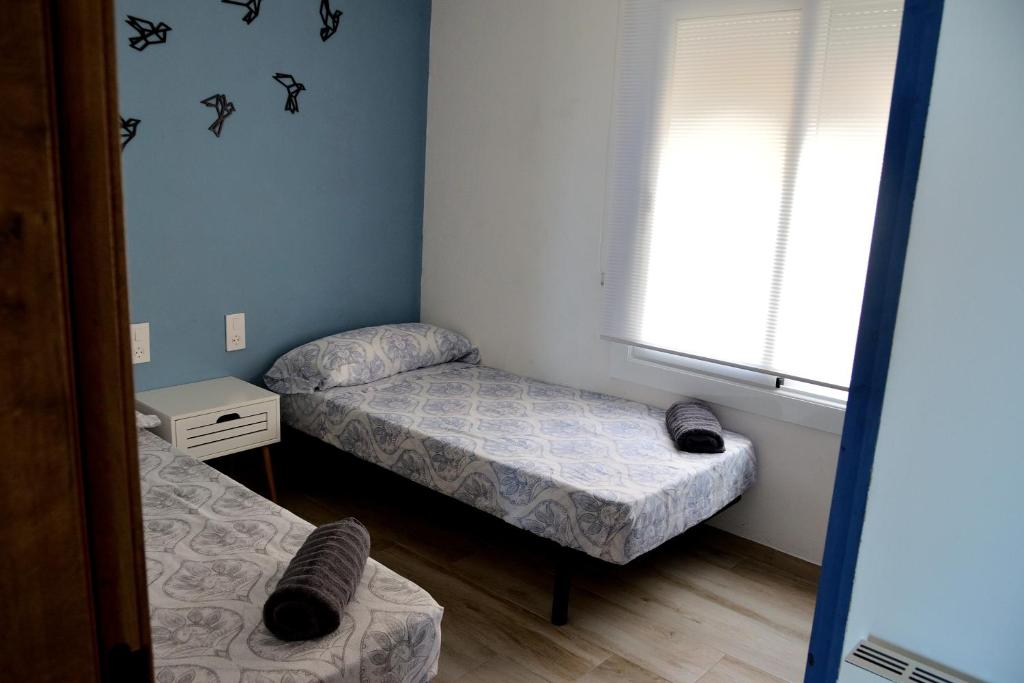 Posteľ alebo postele v izbe v ubytovaní apartamento deluxe cau del llop