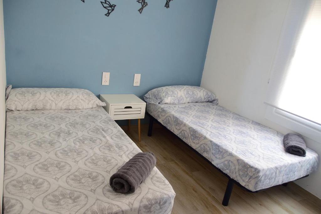 Posteľ alebo postele v izbe v ubytovaní apartamento deluxe cau del llop