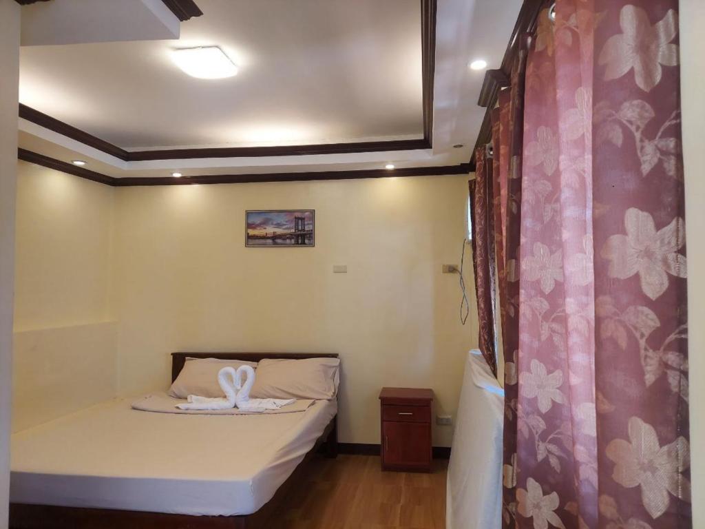 Postel nebo postele na pokoji v ubytování Simala Retreat Resort Cebu