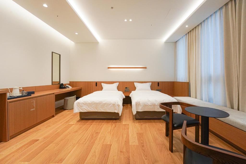 Postel nebo postele na pokoji v ubytování Hotel Ground27