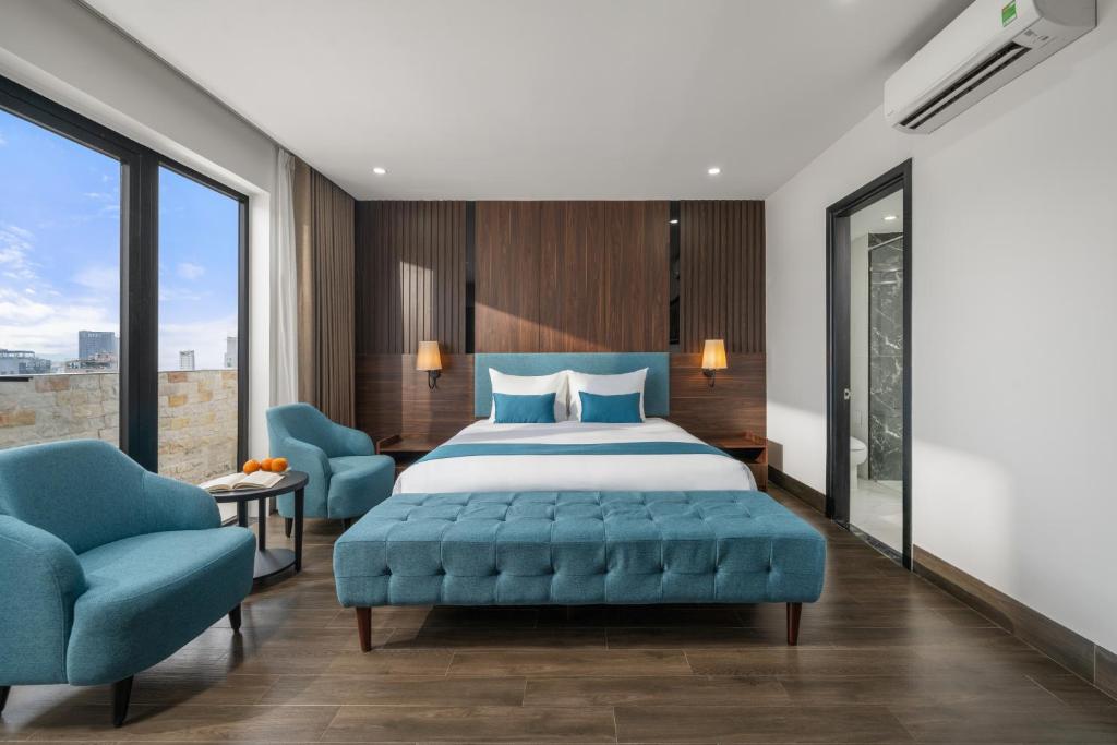 Ένα ή περισσότερα κρεβάτια σε δωμάτιο στο ViAn Hotel And Spa Danang