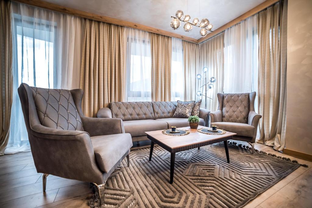 a living room with a couch and a table at Lux Apart Karlovo 1 in Karlovo