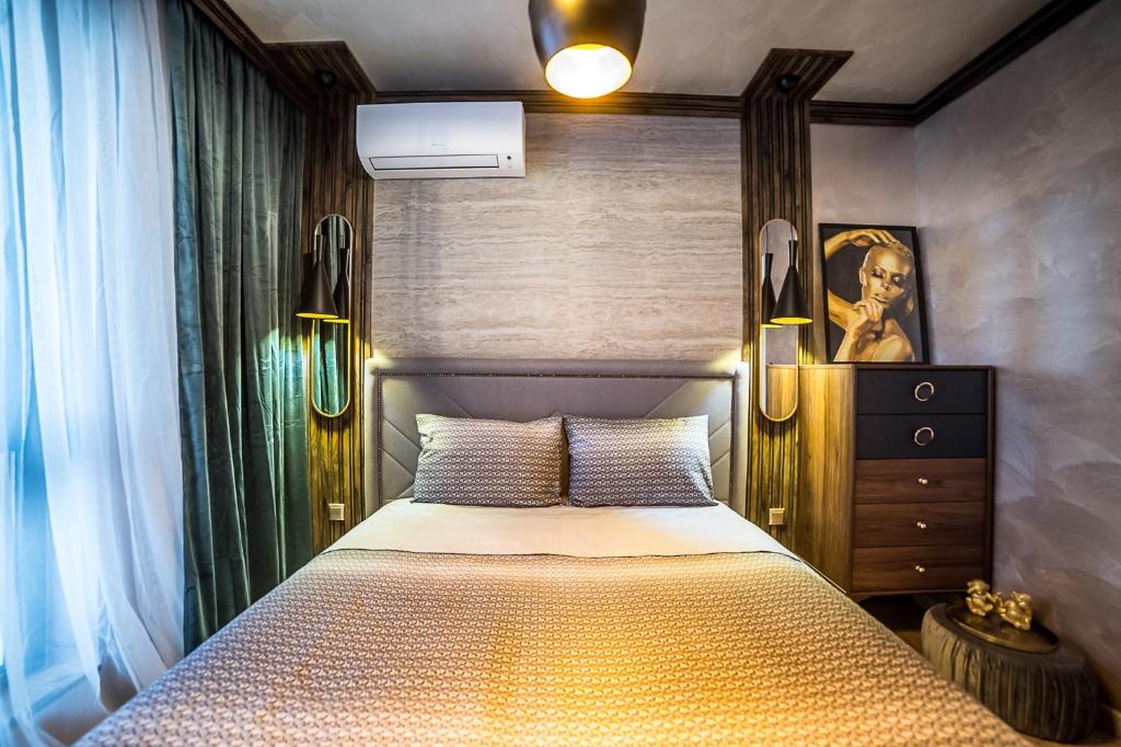 Giường trong phòng chung tại Lux Apart Karlovo 1