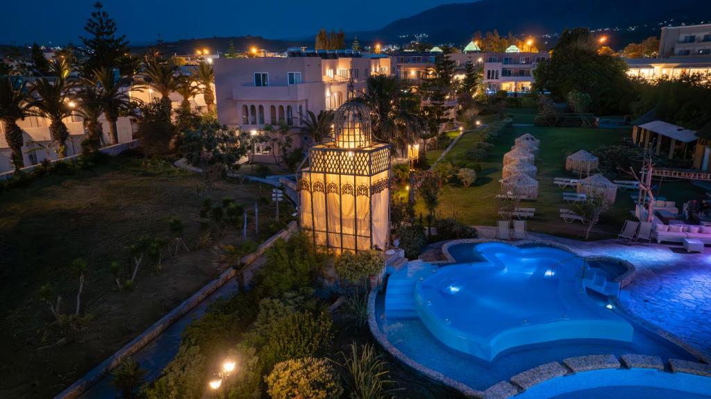 una vista aérea de un complejo por la noche en Orpheas Resort Hotel (Adults Only), en Georgioupolis