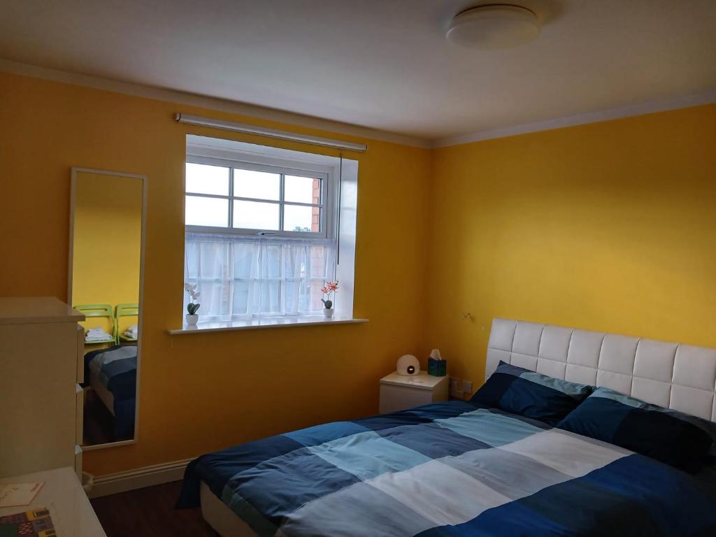 Postel nebo postele na pokoji v ubytování Yellow Room