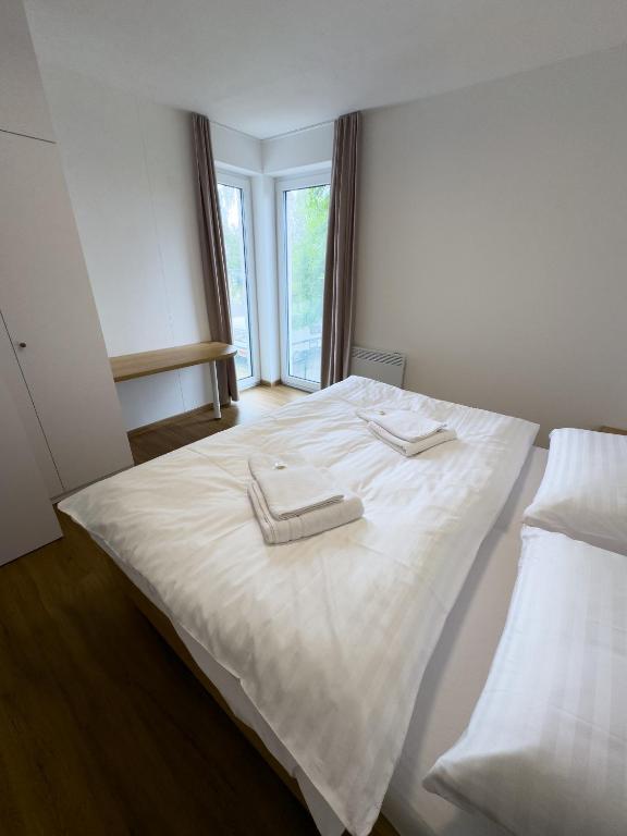 Postel nebo postele na pokoji v ubytování Apartmány Římský vrch