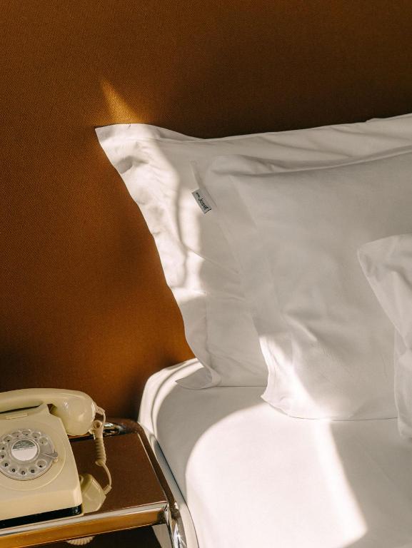 Postel nebo postele na pokoji v ubytování Hotel Josef