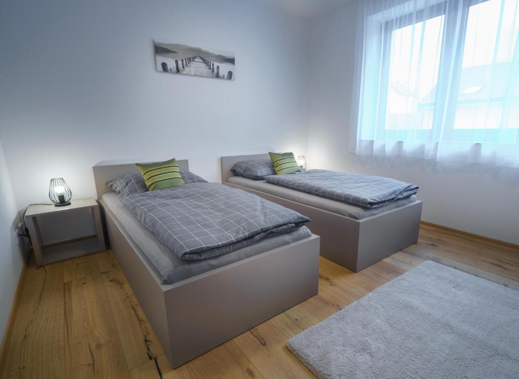 Postel nebo postele na pokoji v ubytování Apartments Poděbradova Premium