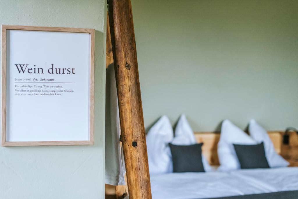 Postel nebo postele na pokoji v ubytování Das Hundert am Eichberg, Südsteiermark