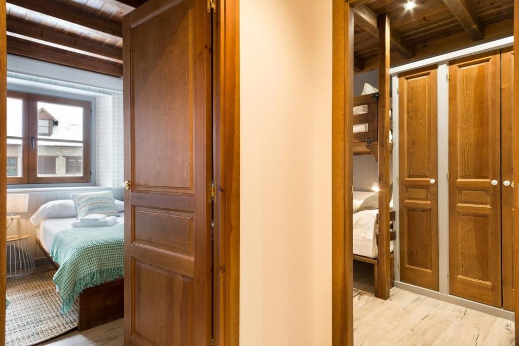 Postel nebo postele na pokoji v ubytování Luderna - Apartamento Val de Ruda B2 Pradets