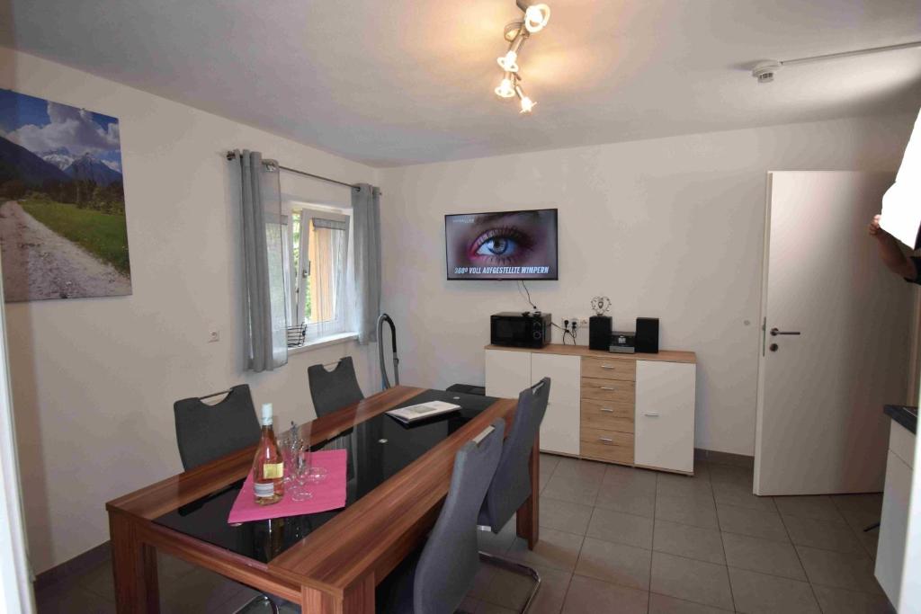 Televízia a/alebo spoločenská miestnosť v ubytovaní Ferienwohnung Collie