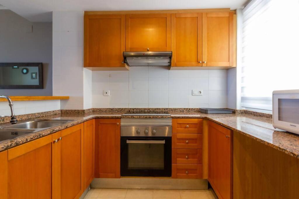 Kuchyň nebo kuchyňský kout v ubytování Oliva Apartamento Terrazamar