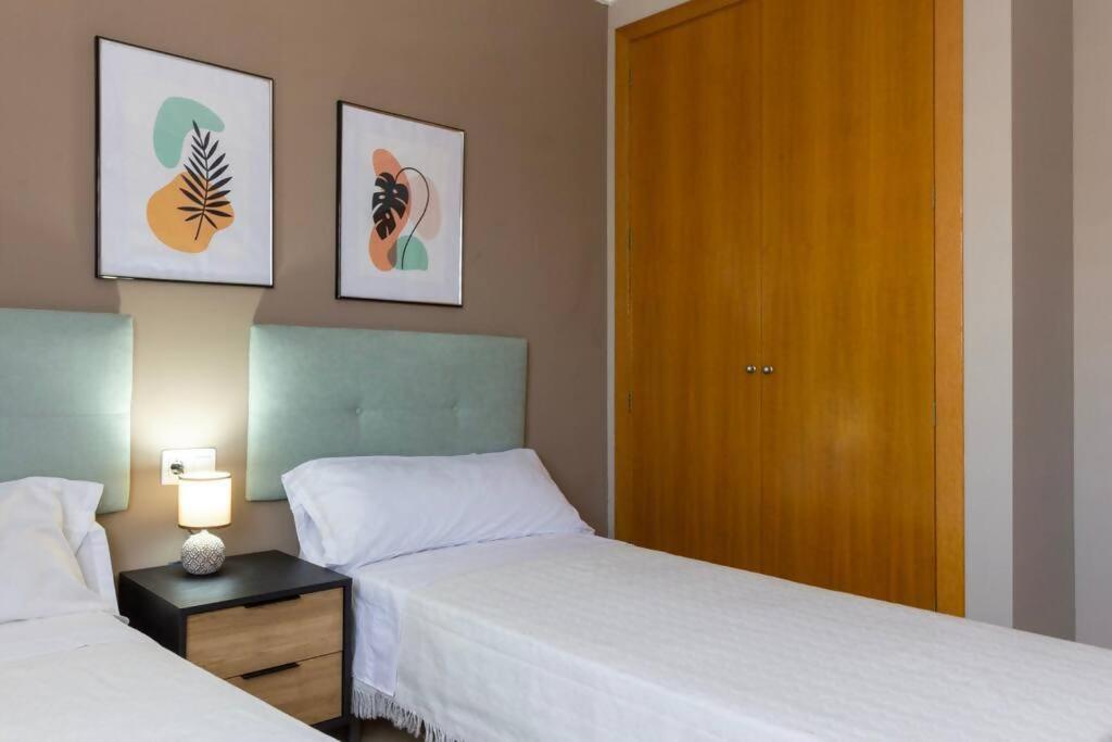 Postel nebo postele na pokoji v ubytování Oliva Apartamento Terrazamar