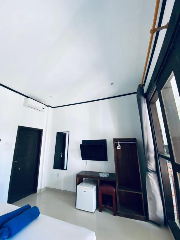 Postel nebo postele na pokoji v ubytování Akalanka Homestay