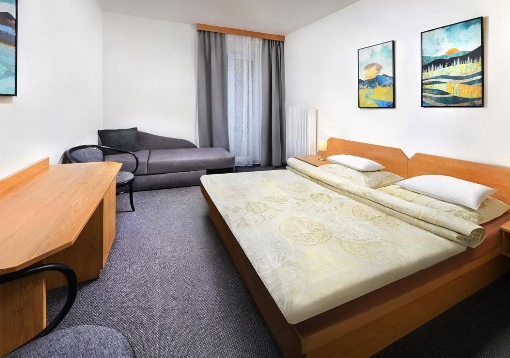 Postel nebo postele na pokoji v ubytování Hotel Liptov