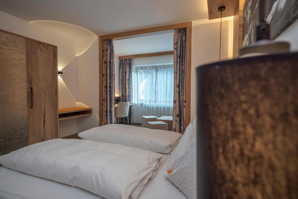 Postel nebo postele na pokoji v ubytování Pension Trojerhof