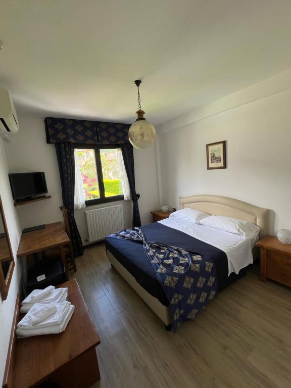 Postel nebo postele na pokoji v ubytování Hotel Merloni