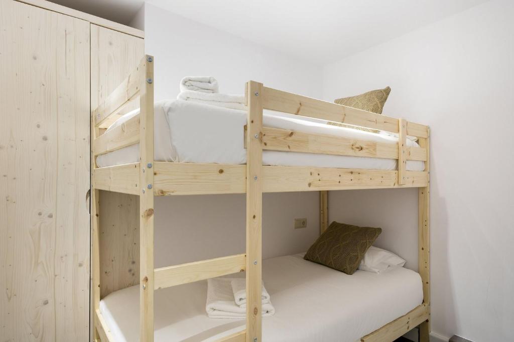 Posteľ alebo postele v izbe v ubytovaní Luderna - Apartamento Mirador de Saumet