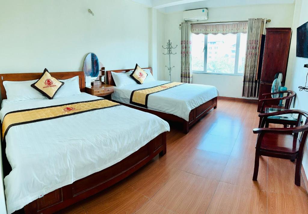 Postel nebo postele na pokoji v ubytování Van Anh Hotel