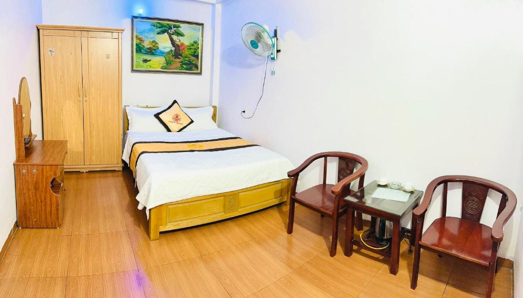 Postel nebo postele na pokoji v ubytování Van Anh Hotel