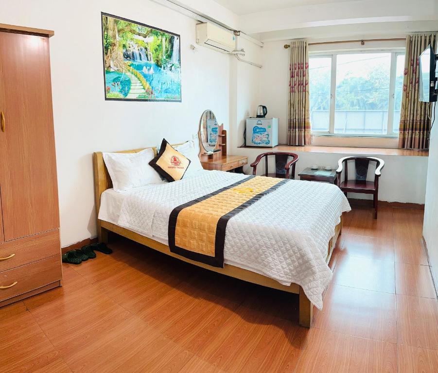 Postel nebo postele na pokoji v ubytování Van Anh Hotel