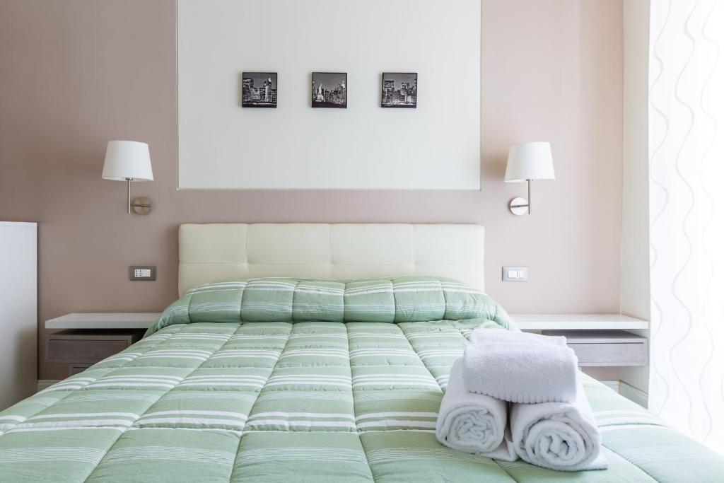 Posteľ alebo postele v izbe v ubytovaní Napoli Heartbeat by Napoliapartments