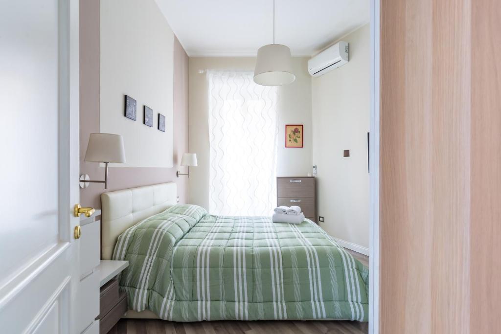 Posteľ alebo postele v izbe v ubytovaní Napoli Heartbeat by Napoliapartments