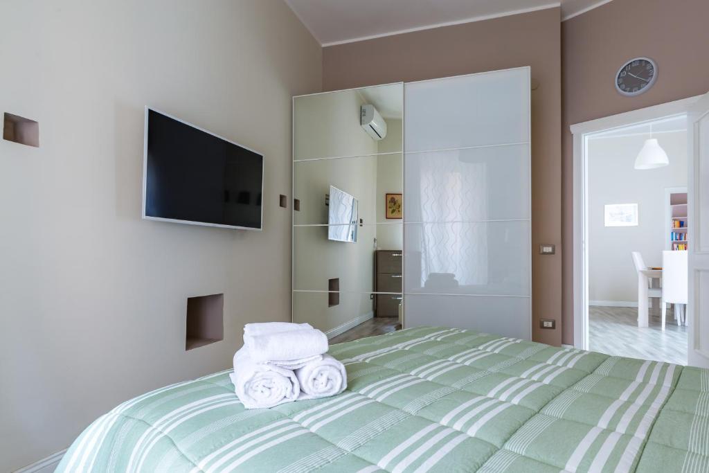 Posteľ alebo postele v izbe v ubytovaní Napoli Heartbeat by Napoliapartments