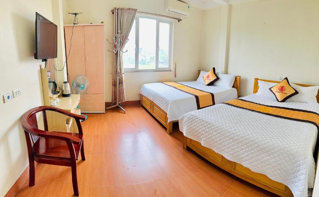 Postel nebo postele na pokoji v ubytování Van Anh Hotel