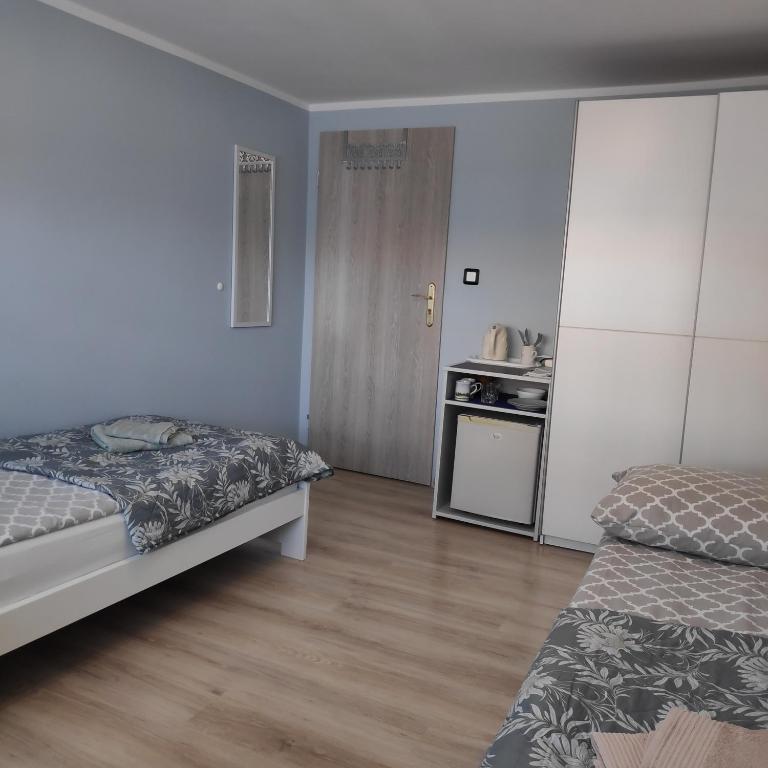 Postel nebo postele na pokoji v ubytování Pokoje gościnne Moli