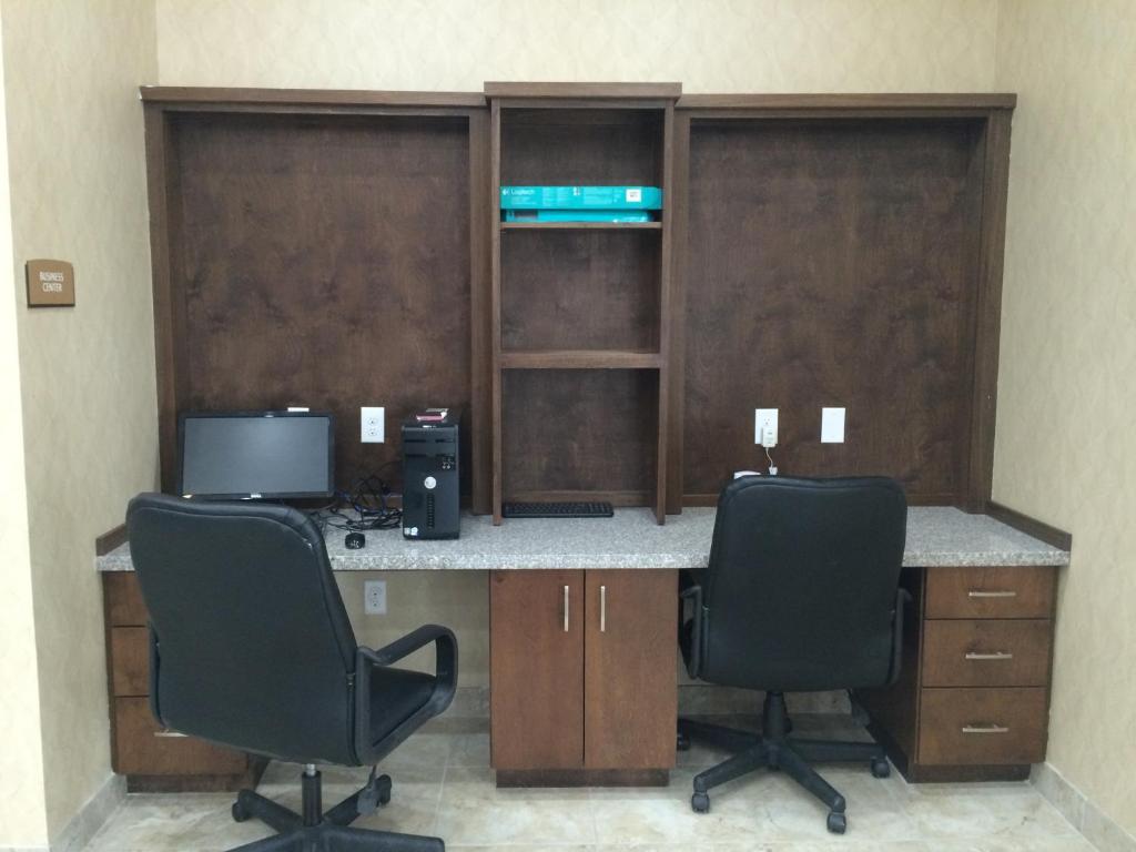 an office with two chairs and a desk with a computer at La Bonita Inn & Suites - Crane in Crane