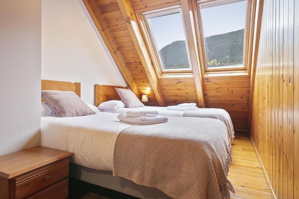 Posteľ alebo postele v izbe v ubytovaní Luderna - Dúplex Gessa C11