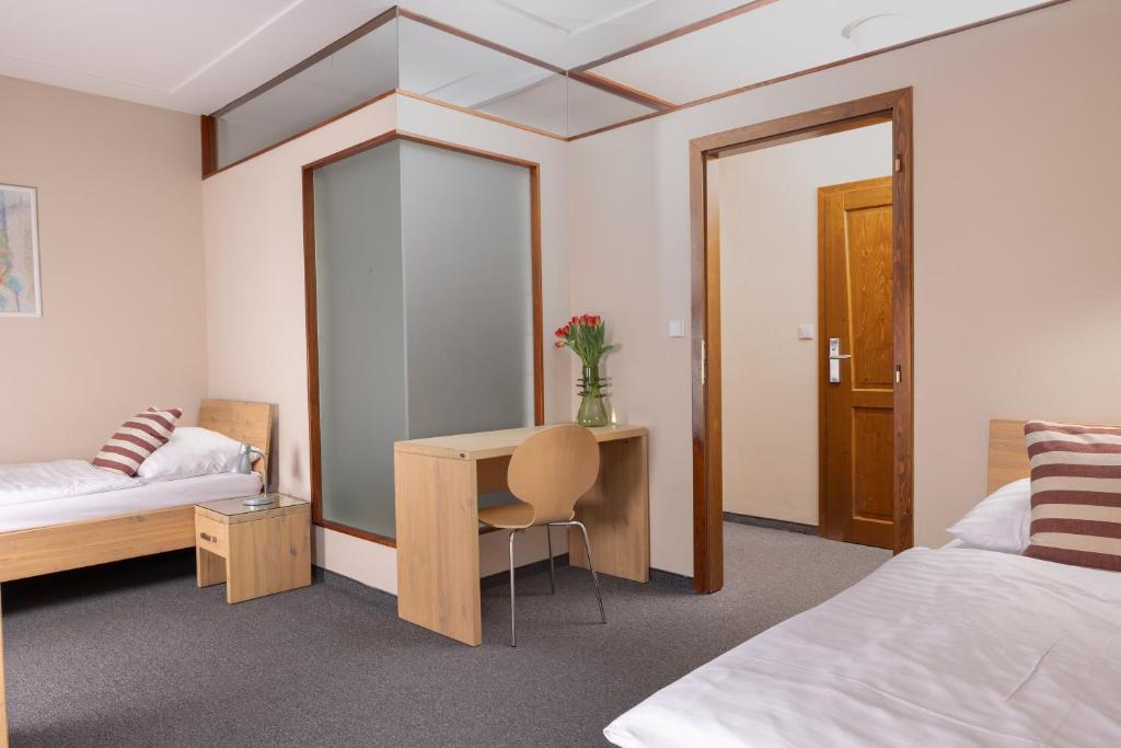 Postel nebo postele na pokoji v ubytování Hotel Praděd Thamm