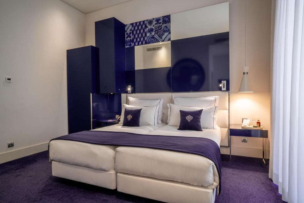 Postel nebo postele na pokoji v ubytování Portugal Boutique Hotel