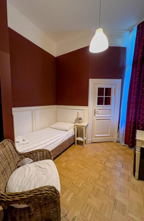 Postel nebo postele na pokoji v ubytování Hotel-Maison Am Olivaer Platz