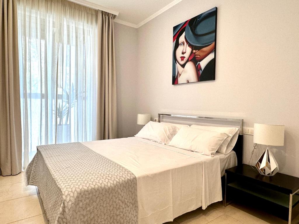 Postel nebo postele na pokoji v ubytování Reinapart Patacona Beachfront Seaview