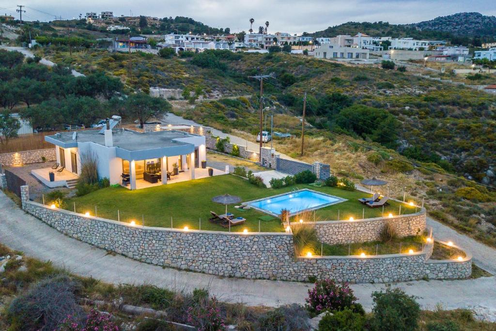 an aerial view of a house with a swimming pool at High View Villa in Afantou
