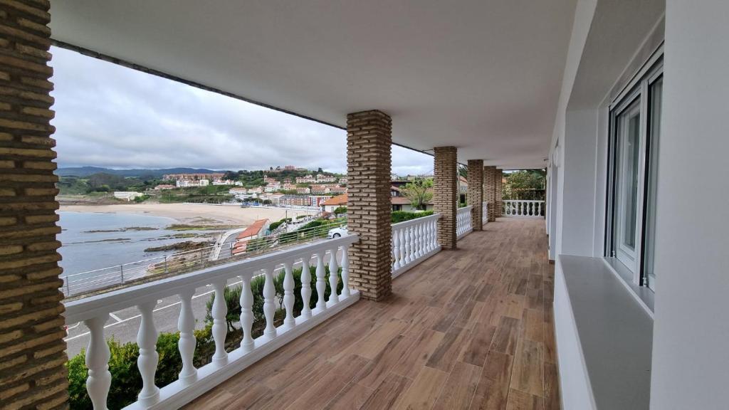 a balcony with a view of the beach at Playa de Comillas in Comillas