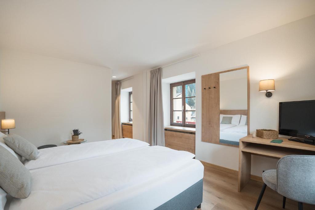 Postel nebo postele na pokoji v ubytování Hotel Brocco & Posta