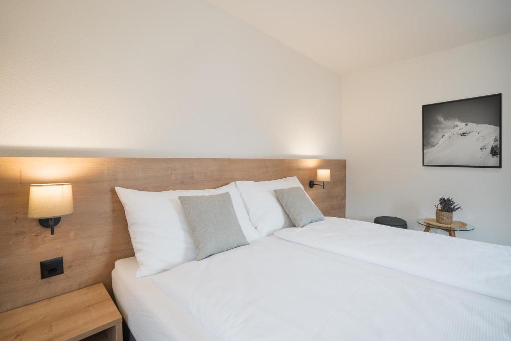 Postel nebo postele na pokoji v ubytování Hotel Brocco & Posta