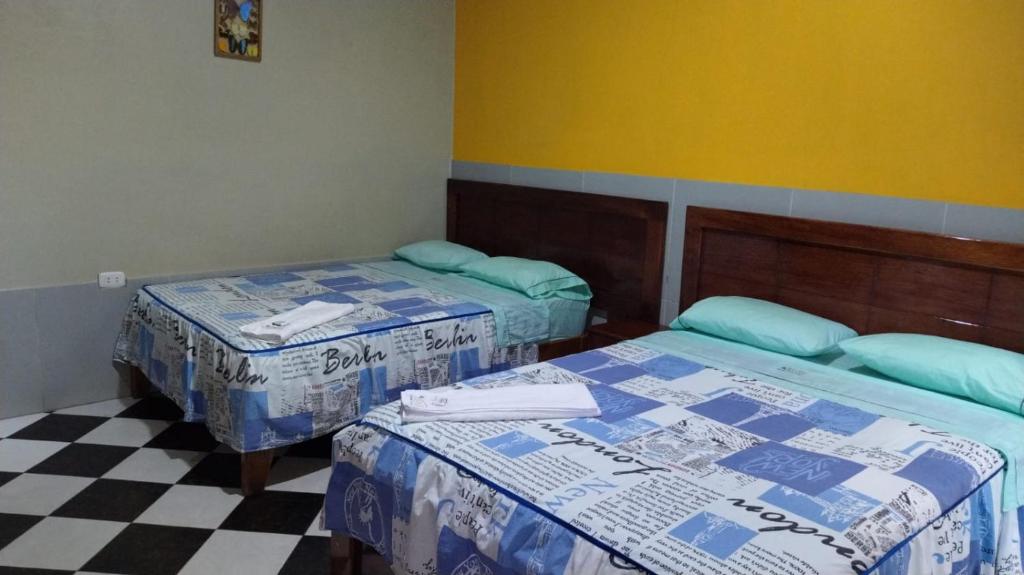 Postel nebo postele na pokoji v ubytování Hospedaje Paraíso