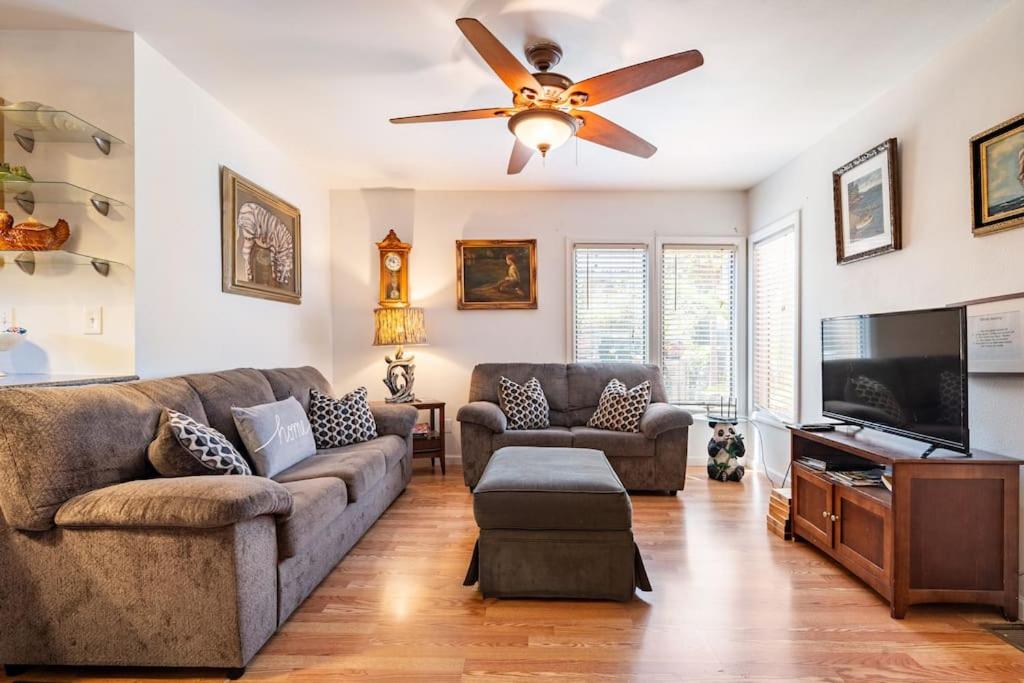 a living room with a couch and a ceiling fan at Serenity House near Gaslamp, San Diego Zoo & Petco in San Diego