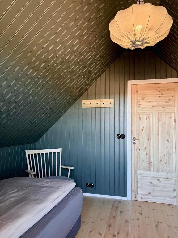 Postel nebo postele na pokoji v ubytování Arngrimslundur Cottages