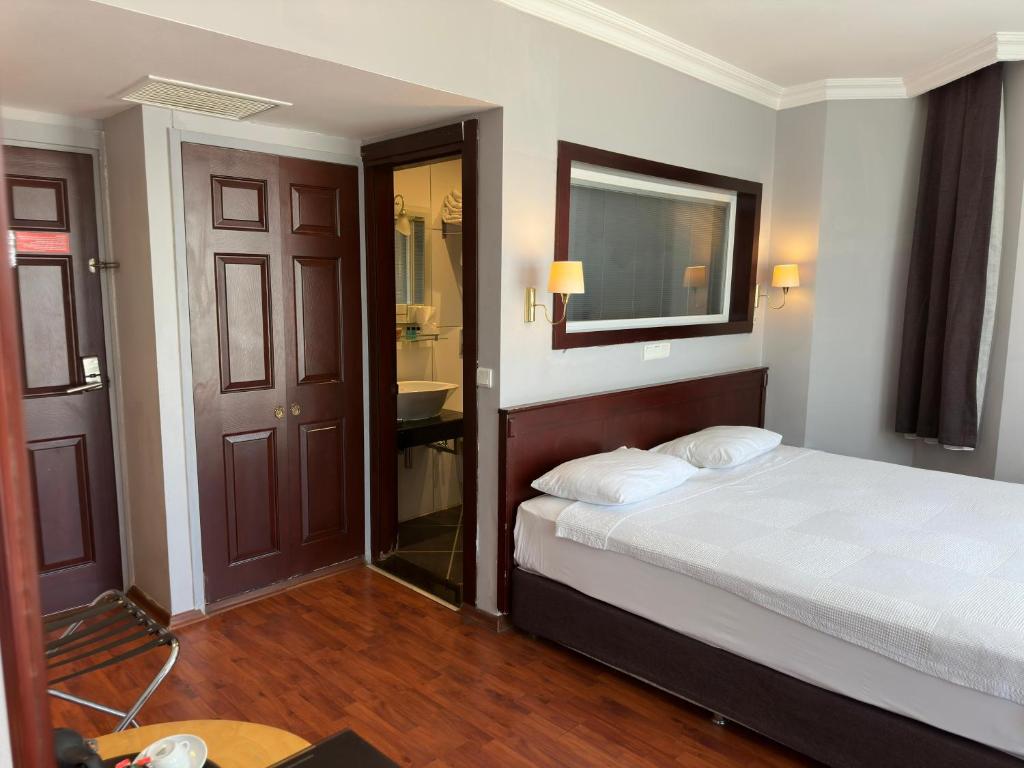 Postel nebo postele na pokoji v ubytování Ata Park Hotel