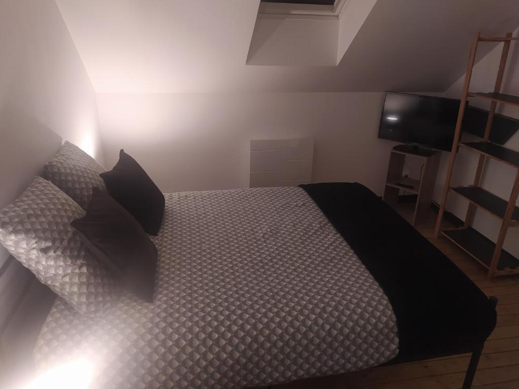 Postel nebo postele na pokoji v ubytování DS Harmothe