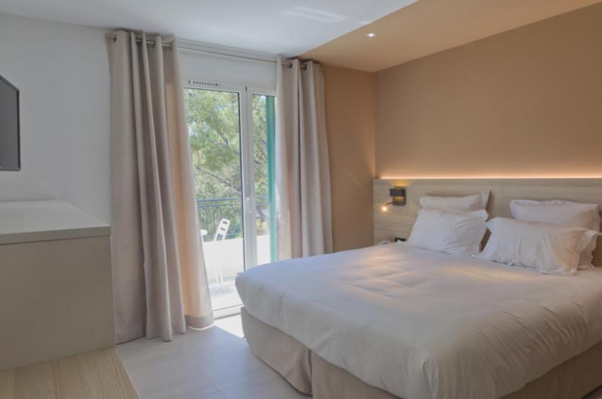Postel nebo postele na pokoji v ubytování Hôtel de la Plage - HDLP