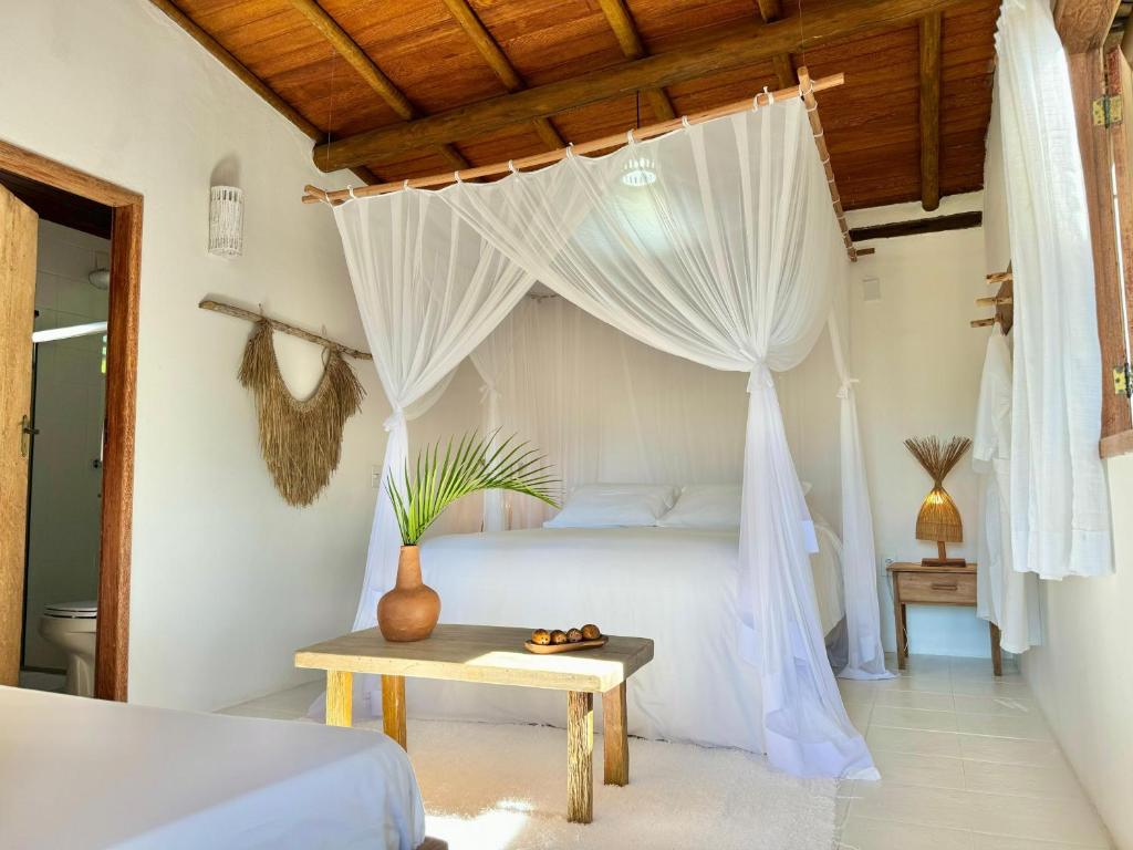 Postel nebo postele na pokoji v ubytování Casa Rabanete Trancoso