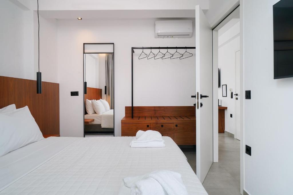 Postel nebo postele na pokoji v ubytování Nuevo Suites