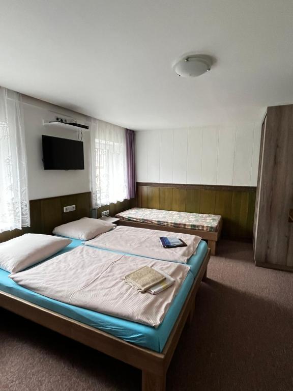 Postel nebo postele na pokoji v ubytování Penzion U Zemánků