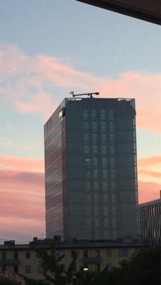 a tall building with a crane on top of it at Penthouse central in Oslo in Oslo